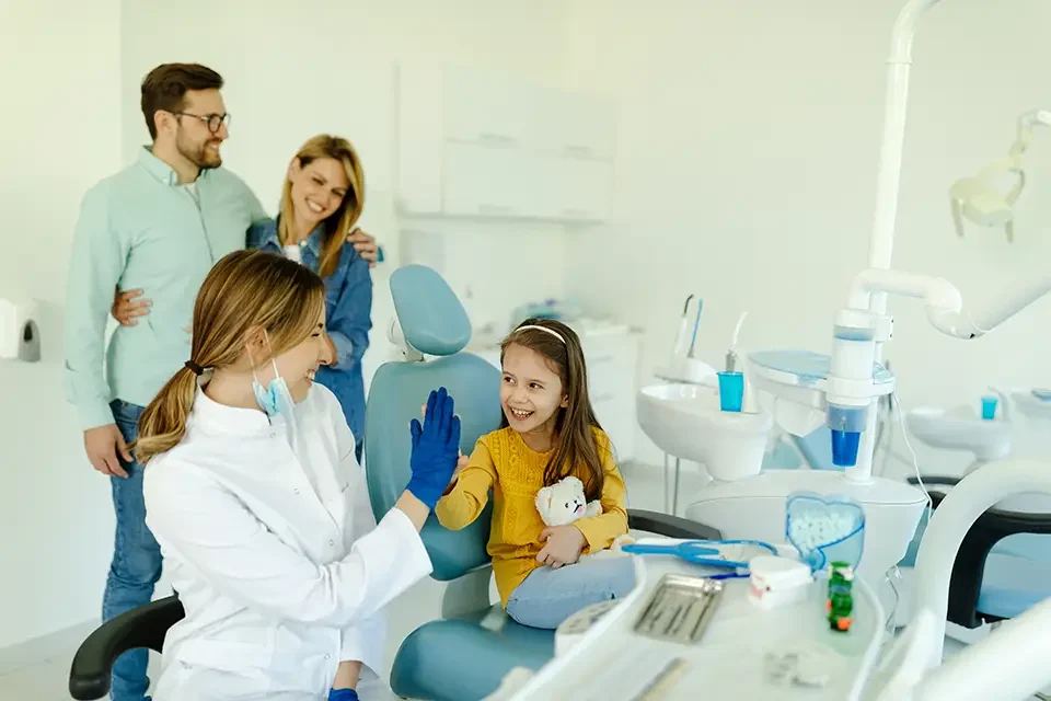 female-doctor-is-giving-hi-five-to-little-girl Signs of a Strong General Dentist for Your Family