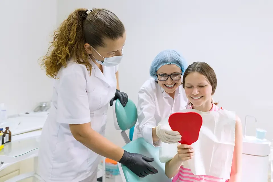 happy-teen-girl-in-dental-chair-medicine-dentist Why a General Dentist for Your Family Makes Life Easier